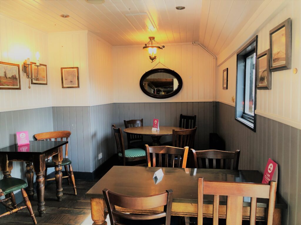 dining tables and attractive barge boarded interior at The Barge Inn Battlesbridge Essex